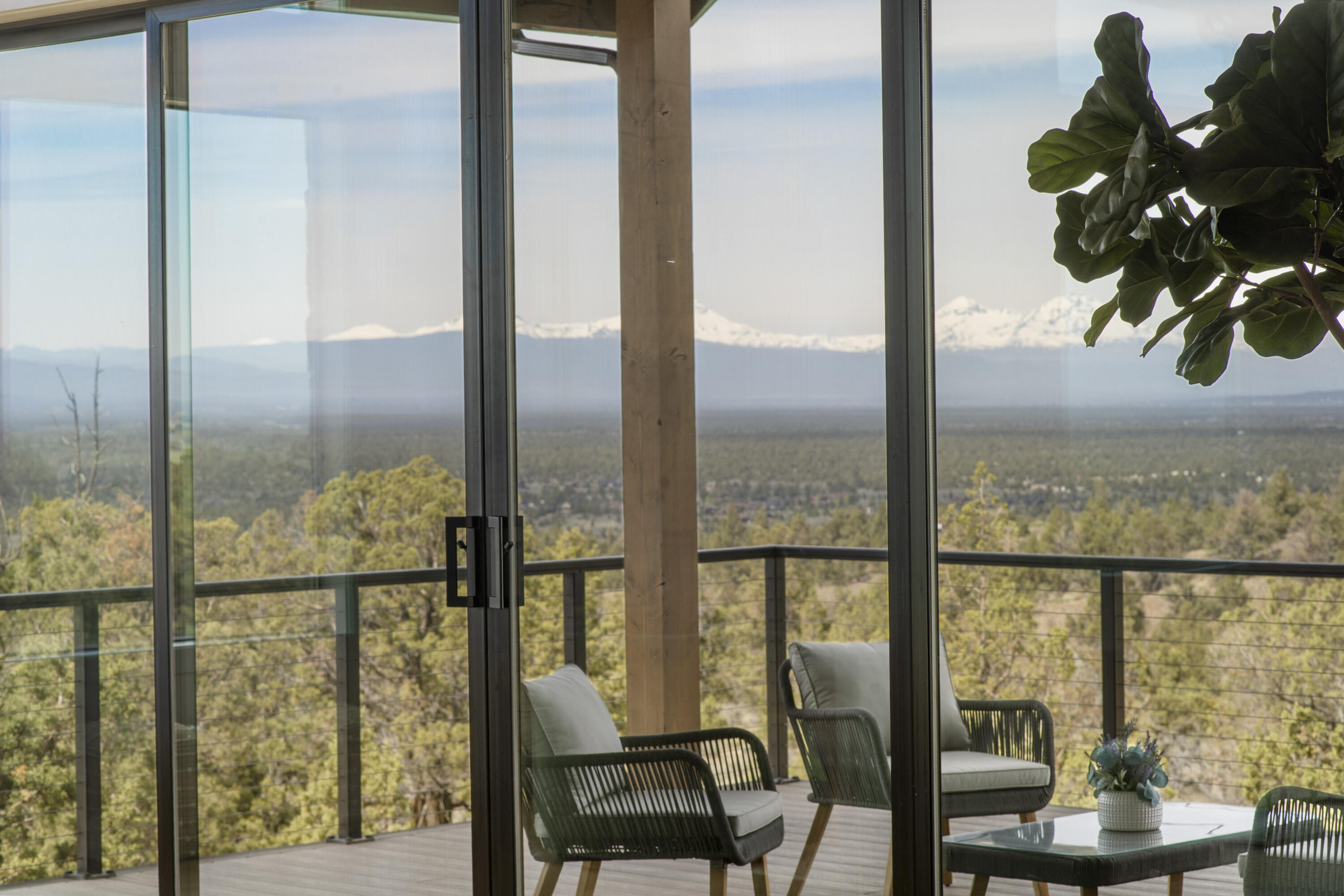 16883 Southwest Paragon Court Powell Butte, OR 97753 - Photo 5 of 42 Great room opens to covered back deck with lots of space and views of a protected community area out to the Cascade Mountains