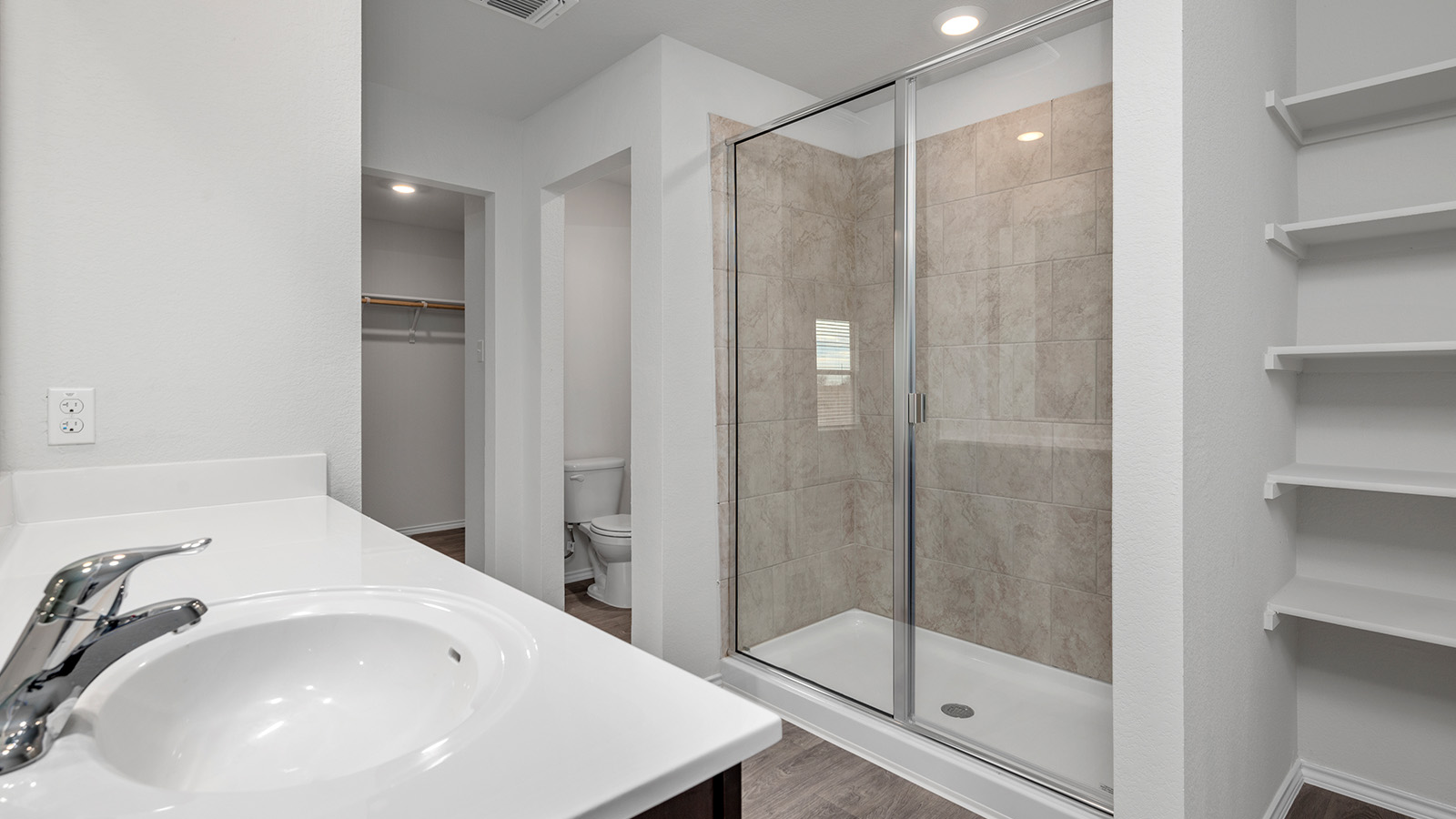 1320 Victory Rnch Trail Killeen, TX 76549 - Photo 12 of 22 Bathroom with a spacious closet, vanity, a shower stall, recessed lighting, and dark wood finished floors