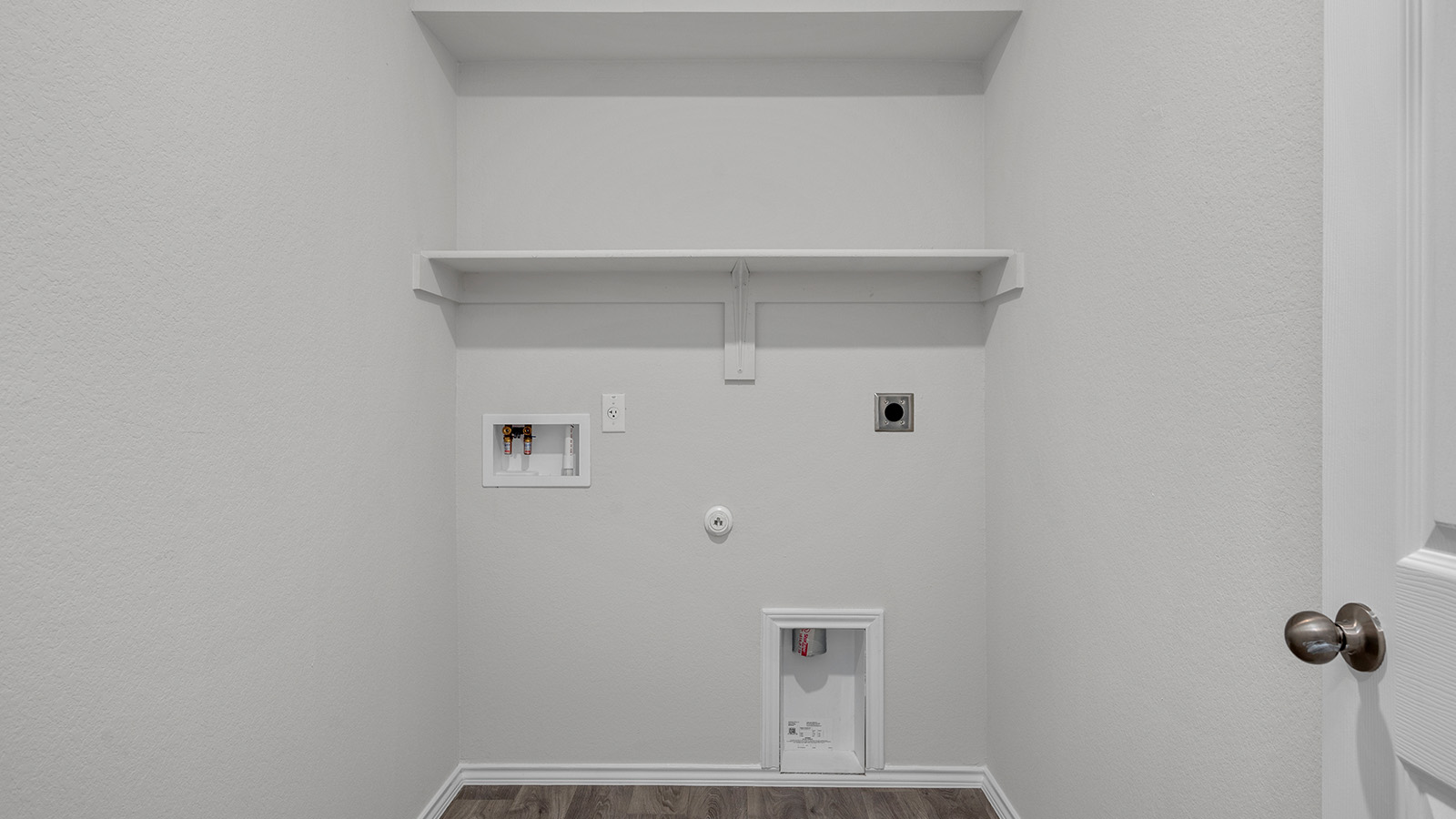 1320 Victory Rnch Trail Killeen, TX 76549 - Photo 19 of 22 Laundry room with hookup for a gas dryer, hookup for a washing machine, hookup for an electric dryer, dark wood-style flooring, and a textured wall