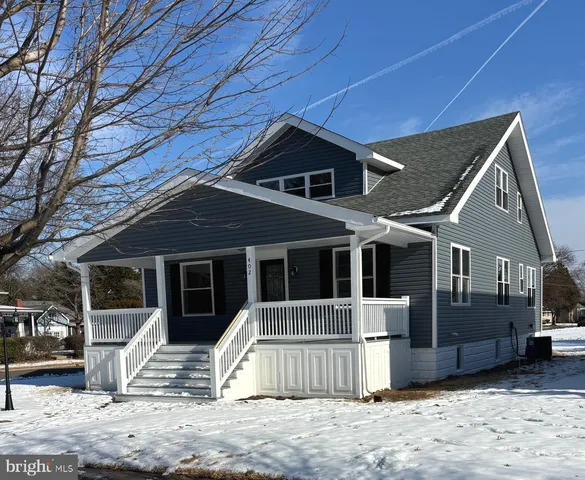 a bathroom with a sink mirror and toilet