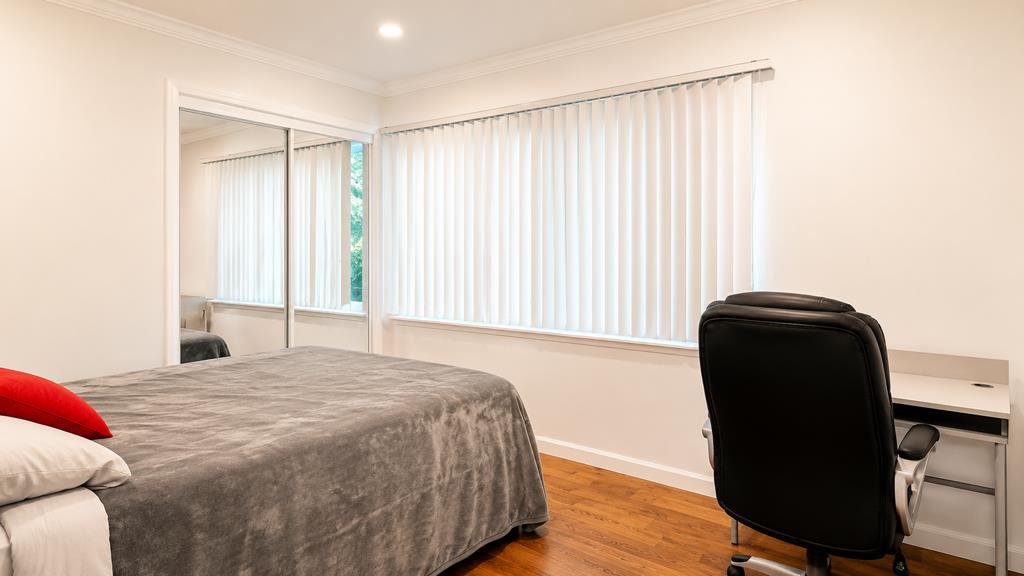 1281 Traynor Road Concord, CA 94520 - Photo 17 of 41 a bedroom with a bed and a chair