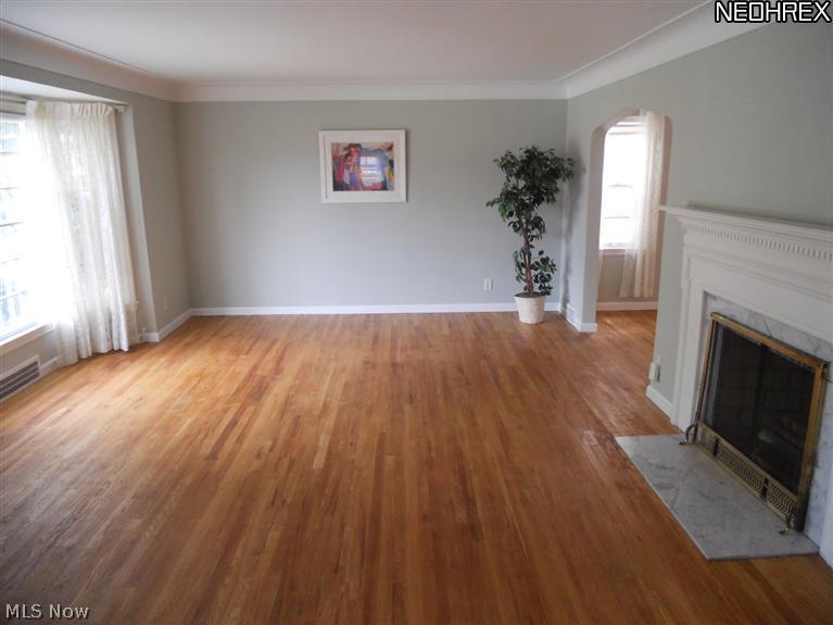 2168 Vernon Road University Heights, OH 44118 - Photo 2 of 11 Living Room with Gleaming Hardwood Floors, Bay Window and Fireplace with Gas Line
