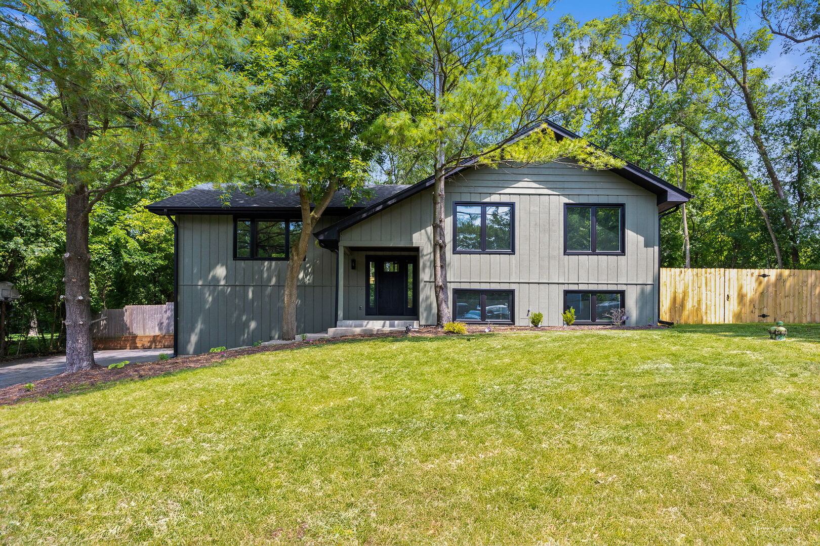 9704 Captains Drive Algonquin, IL 60102 - Photo 1 of 35 a front view of a house with a garden
