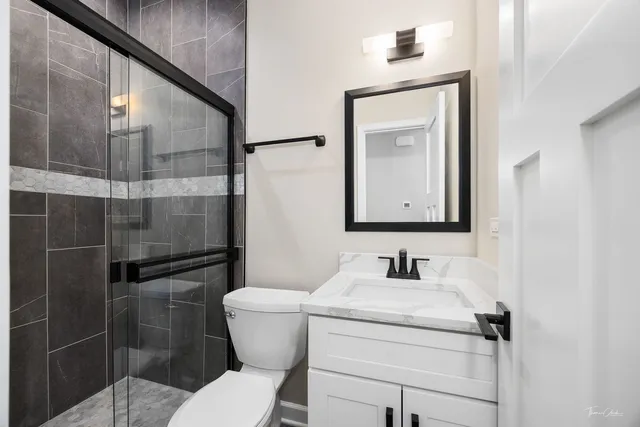 an aerial view of residential house with outdoor space and lake view