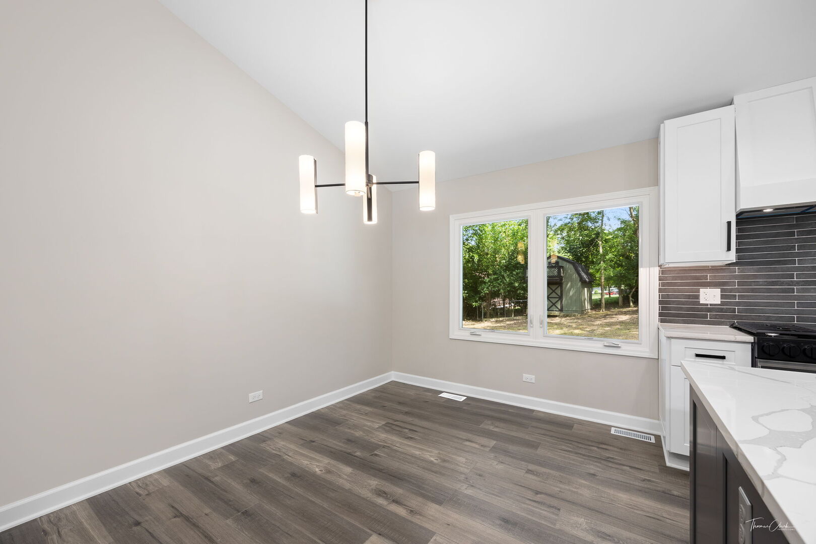 9704 Captains Drive Algonquin, IL 60102 - Photo 6 of 35 a view of a kitchen with a sink wooden floor and a window
