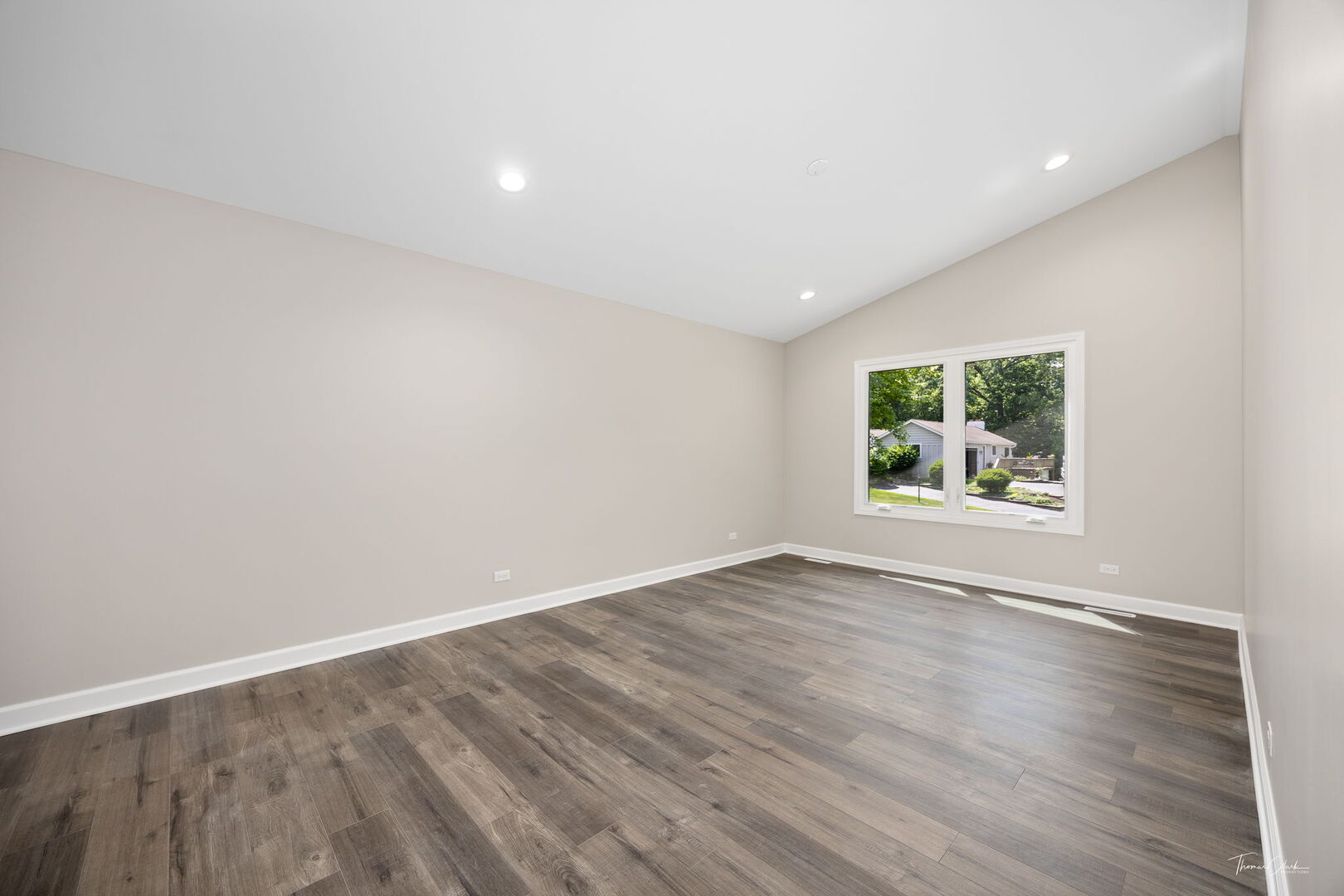 9704 Captains Drive Algonquin, IL 60102 - Photo 9 of 35 a view of an empty room with wooden floor and a window