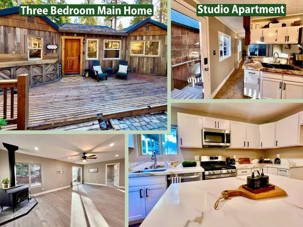a view of a patio with table and chairs with wooden floor and fence
