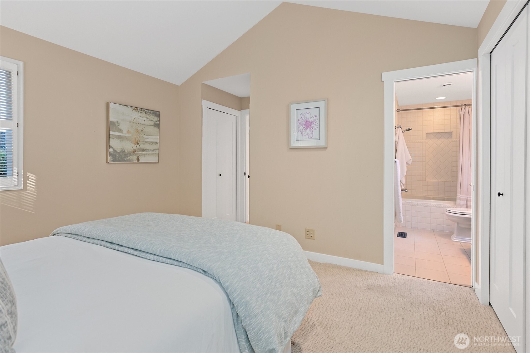 975 Northwest Inneswood Place Issaquah, WA 98027 - Photo 11 of 21 a bedroom with a bed and a painting on the wall