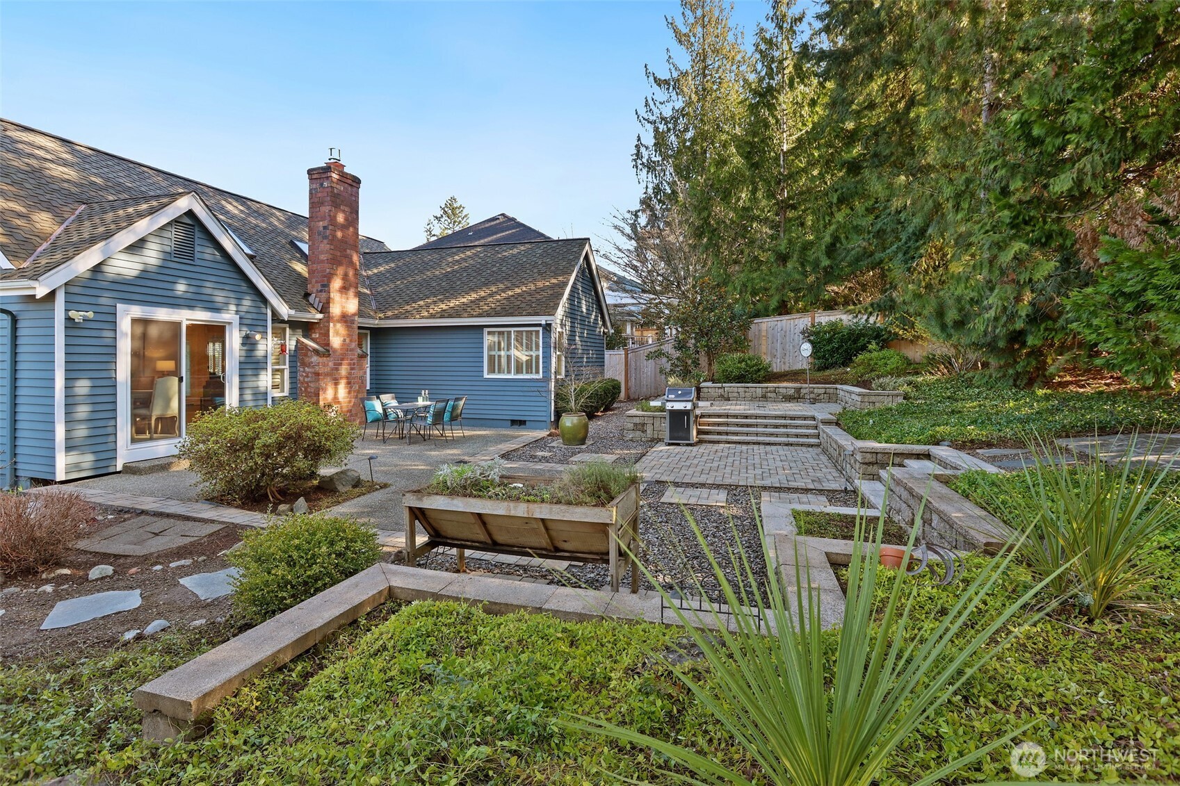 975 Northwest Inneswood Place Issaquah, WA 98027 - Photo 17 of 21 a front view of a house with a yard