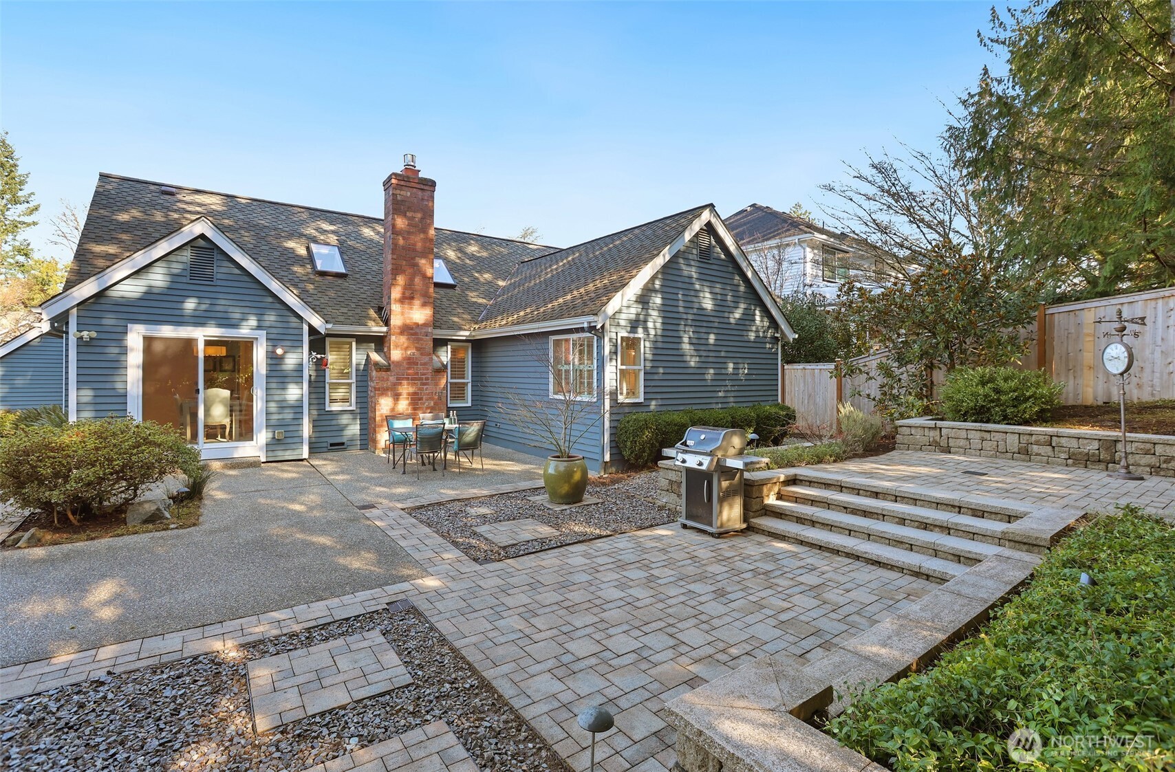 975 Northwest Inneswood Place Issaquah, WA 98027 - Photo 18 of 21 a front view of a house with a garden