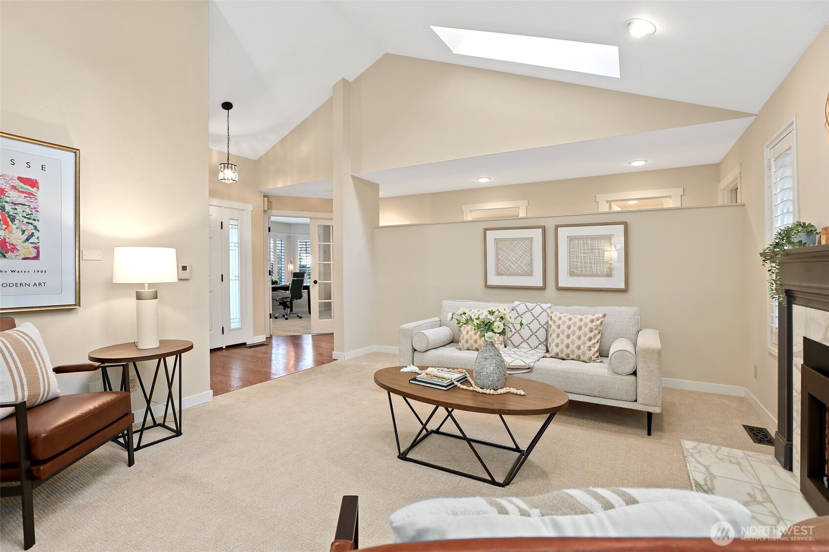 975 Northwest Inneswood Place Issaquah, WA 98027 - Photo 2 of 21 a living room with furniture and a wooden floor