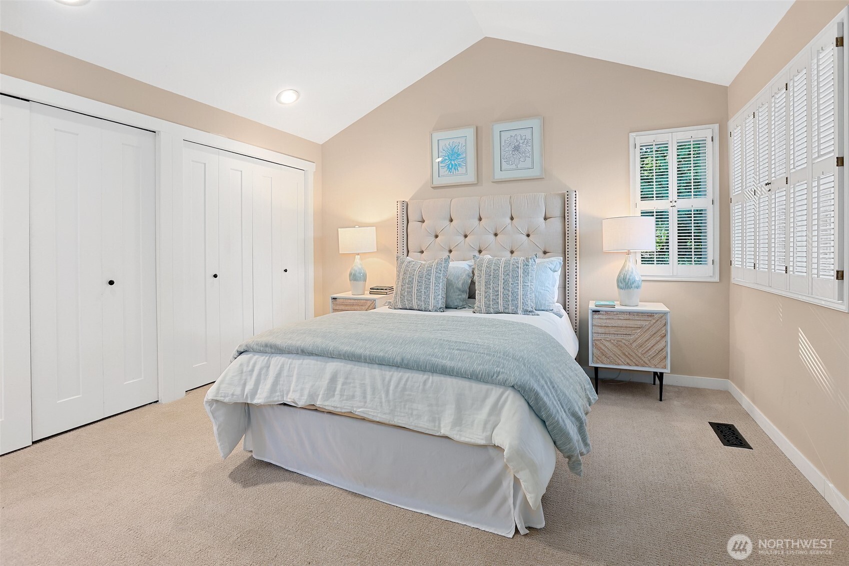 975 Northwest Inneswood Place Issaquah, WA 98027 - Photo 10 of 21 a spacious bedroom with a bed and a window