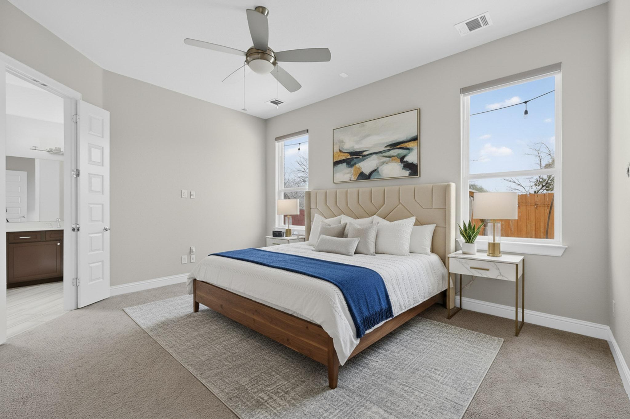 3137 Catalina Ranch Road Leander, TX 78641 - Photo 19 of 21 Bedroom with light carpet, a ceiling fan, and ensuite bath
