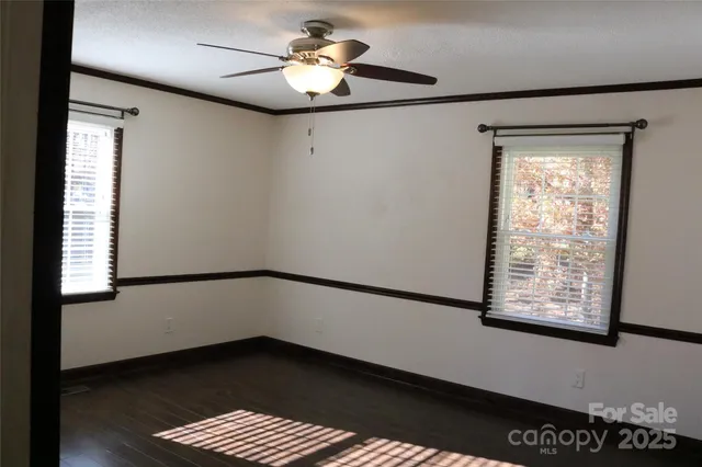 a bathroom with a toilet a sink and a mirror