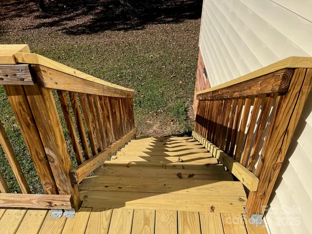an empty room with wooden floor and a window