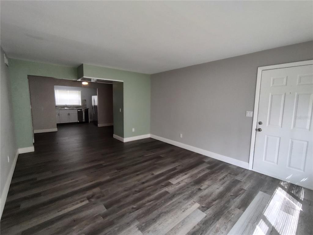 320 West Howry Avenue, Unit 1 Deland, FL 32720 - Photo 11 of 33 a view of gallery with wooden floor