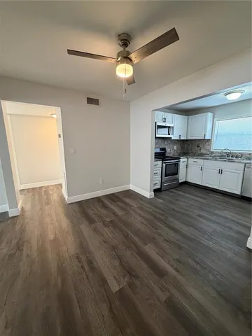 a room with furniture and wooden floor
