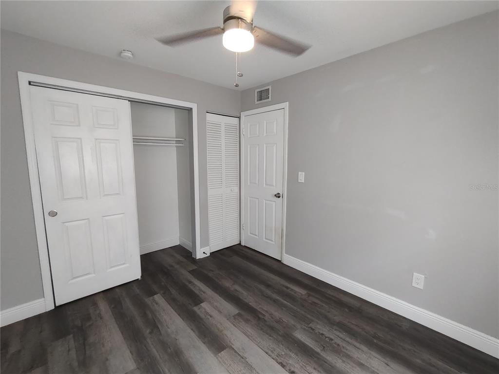 320 West Howry Avenue, Unit 1 Deland, FL 32720 - Photo 19 of 33 a view of entryway with wooden floor