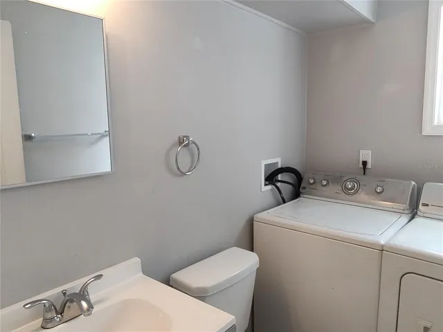 a bathroom with a sink and a toilet