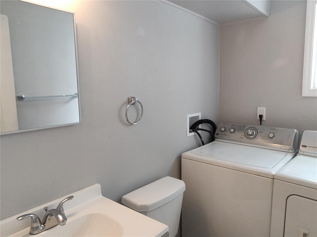 320 West Howry Avenue, Unit 1 Deland, FL 32720 - Photo 21 of 33 a bathroom with a sink and a toilet