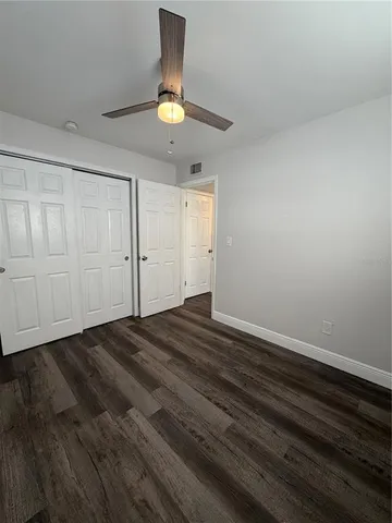 an empty room with wooden floor