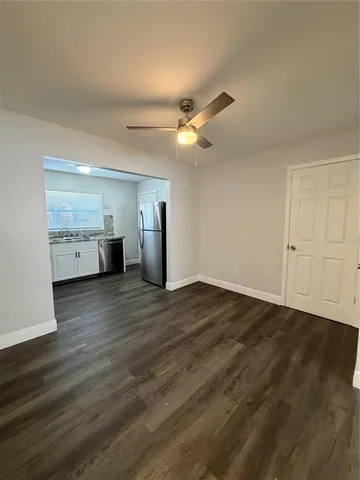 a view of a kitchen with a dishwasher cabinets and wooden floor