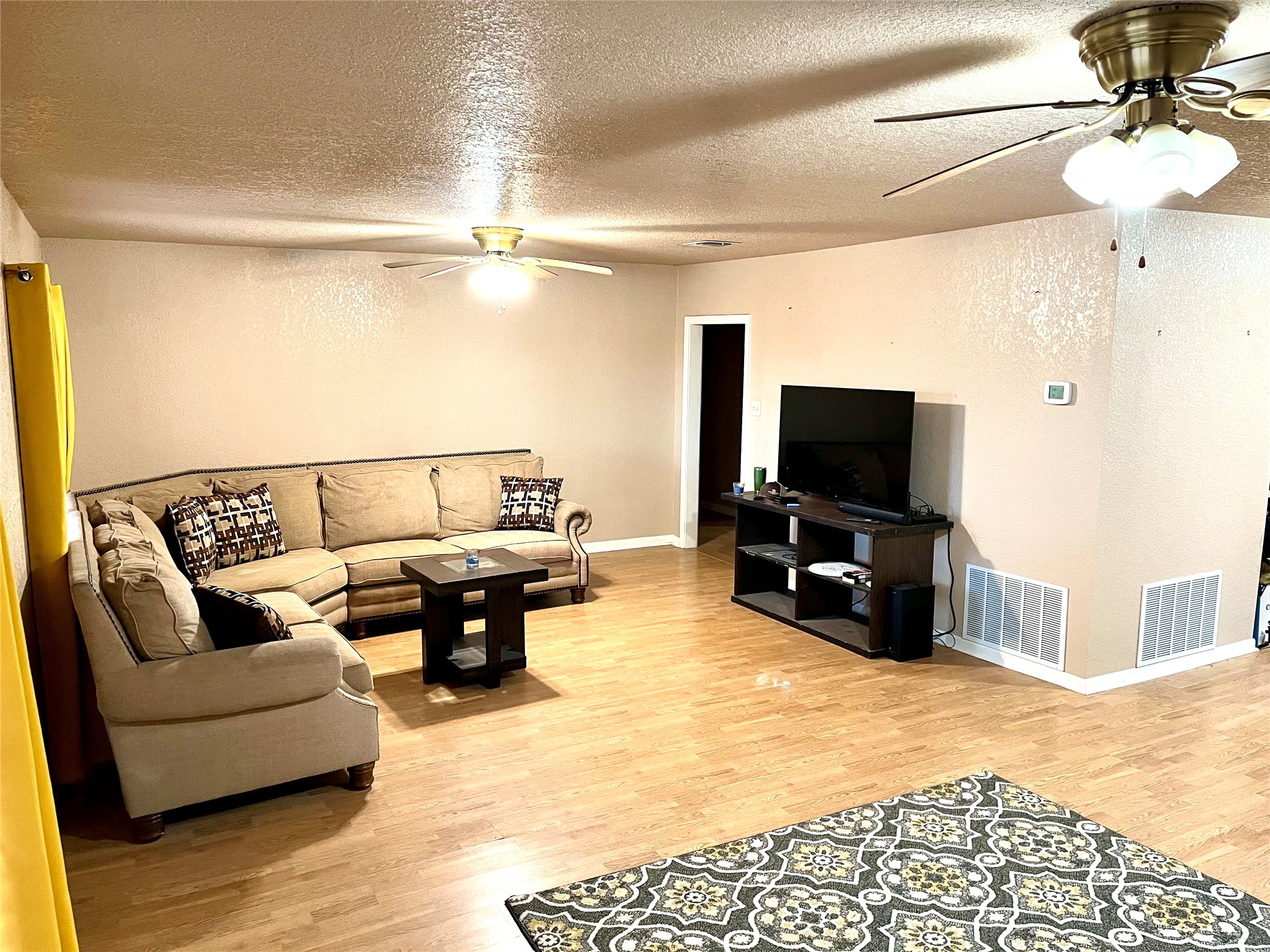 307 5th Street Sutherland Springs, TX 78161 - Photo 11 of 17 a living room with furniture and a flat screen tv