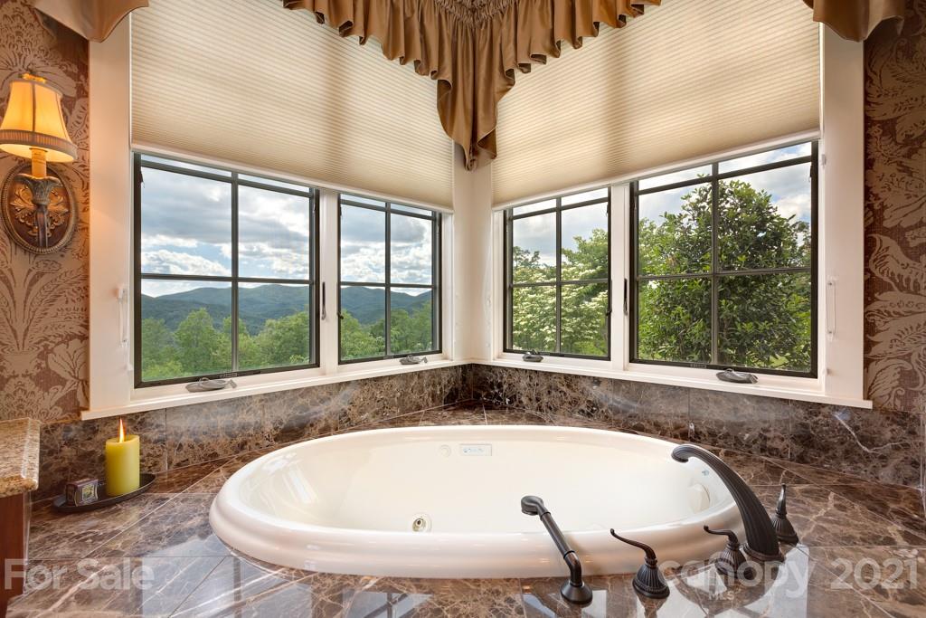 125 Stone Brook Trail Black Mountain, NC 28711 - Photo 27 of 48 a bath tub sitting in front of a window