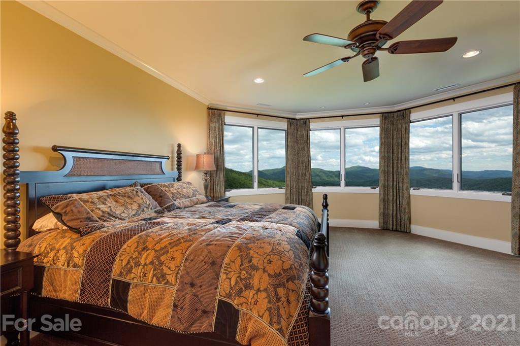 125 Stone Brook Trail Black Mountain, NC 28711 - Photo 31 of 48 a bed sitting in a bedroom next to a large window