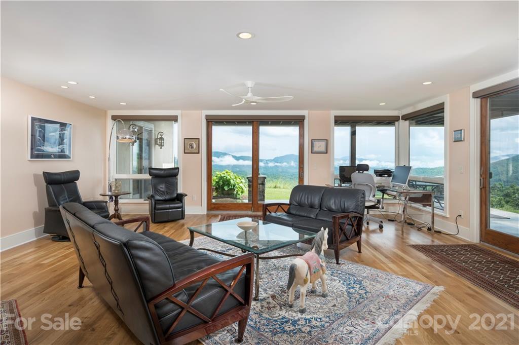 125 Stone Brook Trail Black Mountain, NC 28711 - Photo 33 of 48 a living room with fireplace furniture and a rug