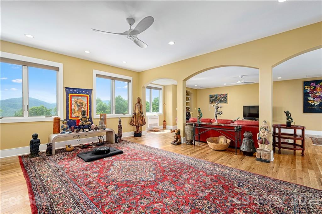 125 Stone Brook Trail Black Mountain, NC 28711 - Photo 34 of 48 a living room with furniture fireplace and a large window