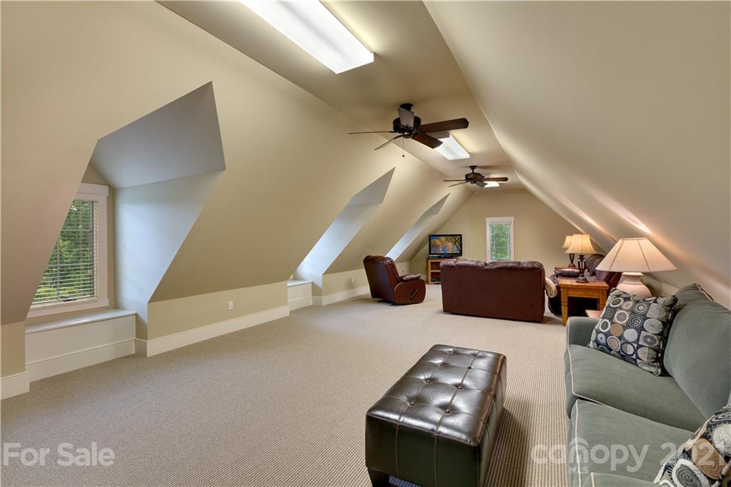 125 Stone Brook Trail Black Mountain, NC 28711 - Photo 38 of 48 a living room with furniture and a chandelier