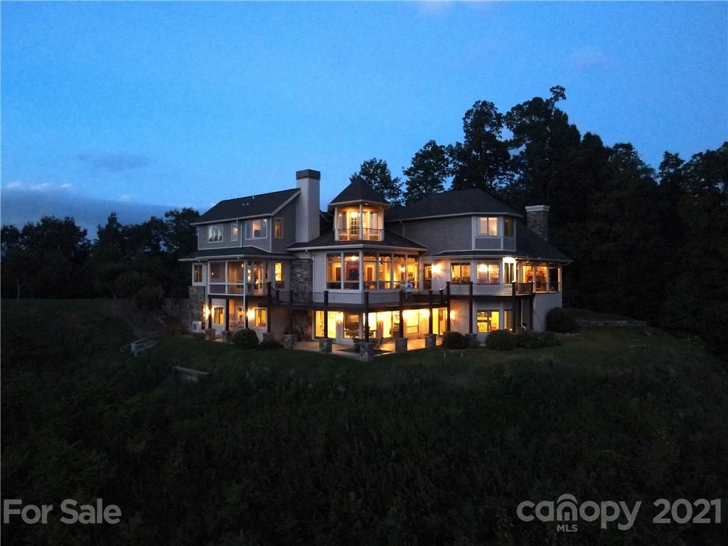 125 Stone Brook Trail Black Mountain, NC 28711 - Photo 4 of 48 a front view of a house with a garden