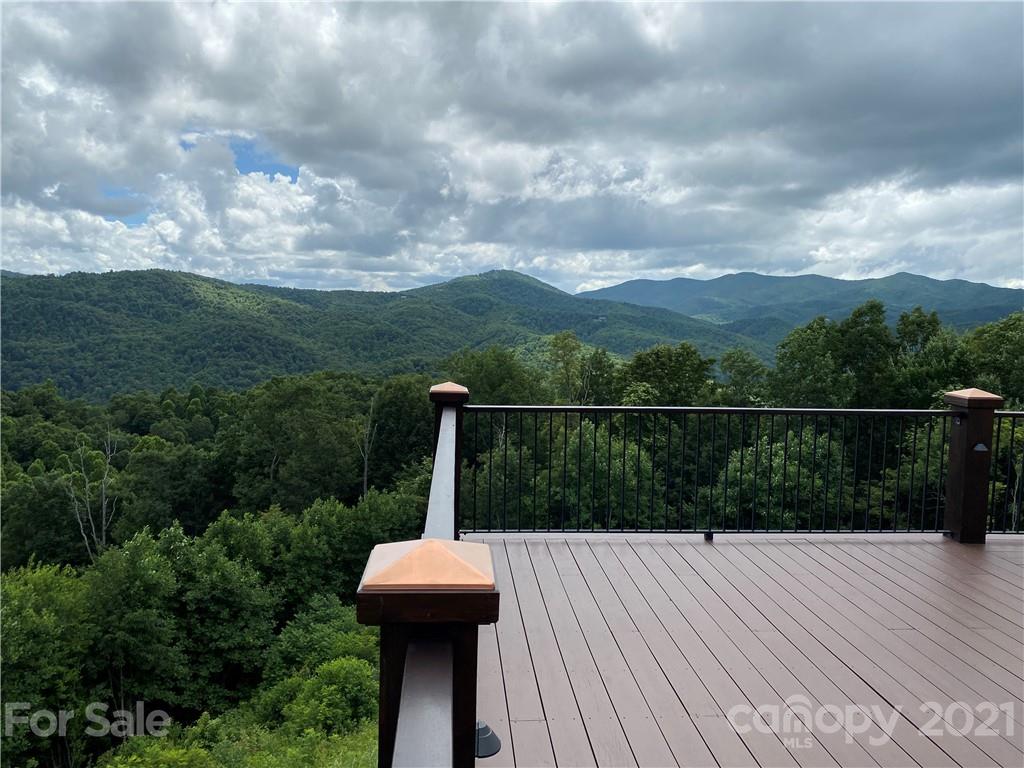125 Stone Brook Trail Black Mountain, NC 28711 - Photo 43 of 48 a view of a balcony with wooden floor and fence
