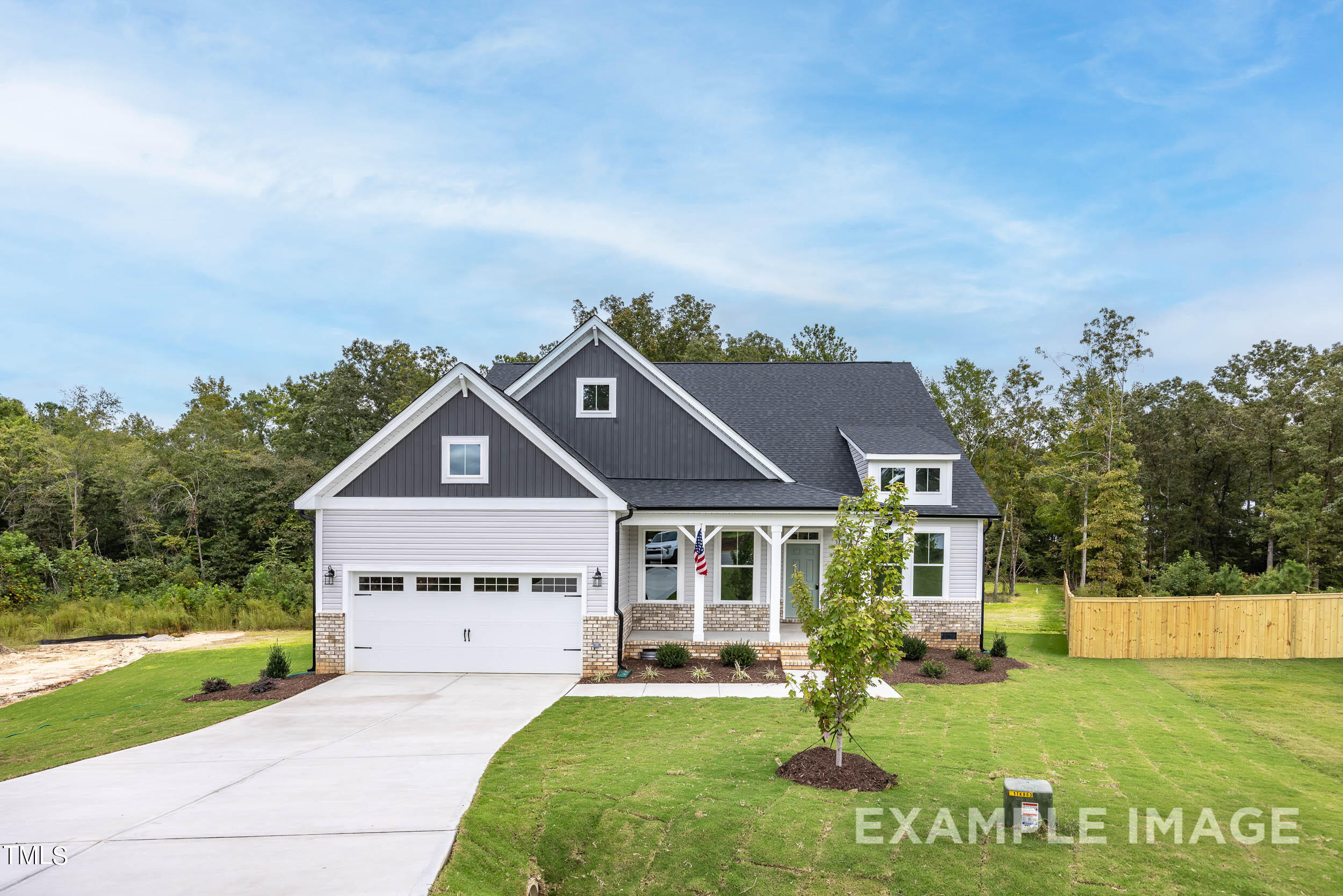 238 Harvester Road, Unit 5 Angier, NC 27501 - Photo 1 of 6 a front view of a house with a yard