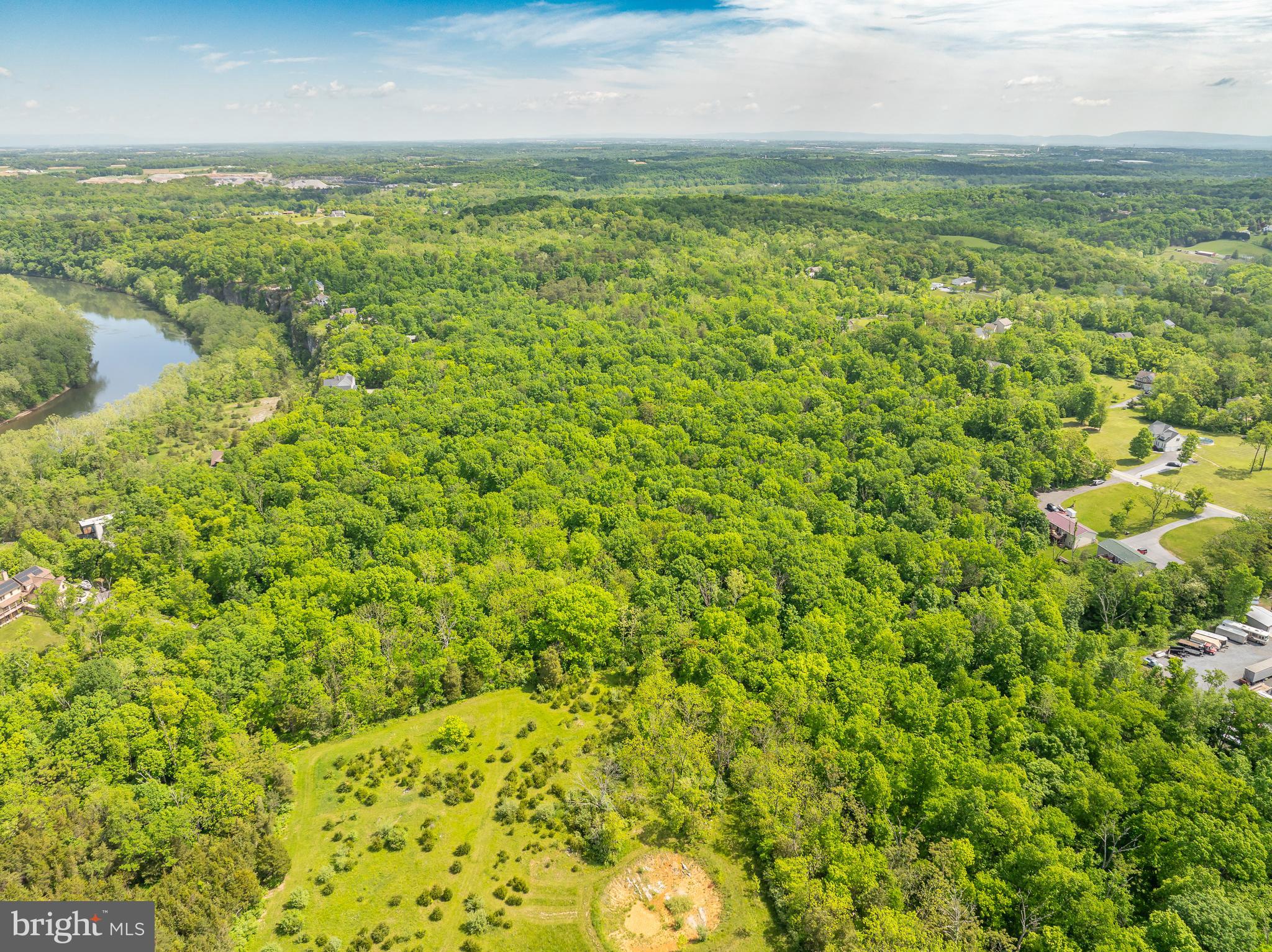 Lot 33 Nestle Quarry Road Falling Waters, WV 25419 - Photo 25 of 27 a view of a lake from a yard