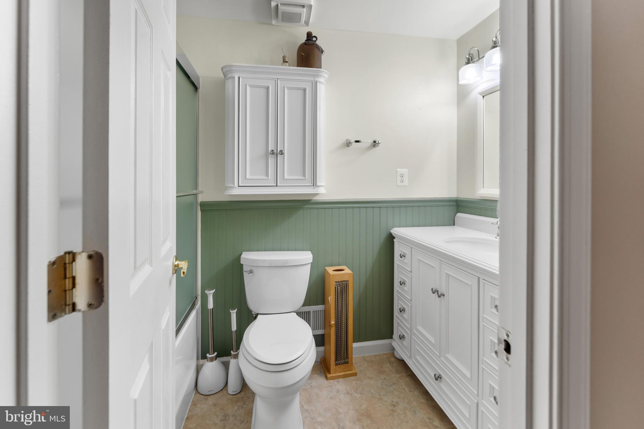 5922 Michael Road Waldorf, MD 20601 - Photo 17 of 43 a bathroom with a toilet sink and mirror