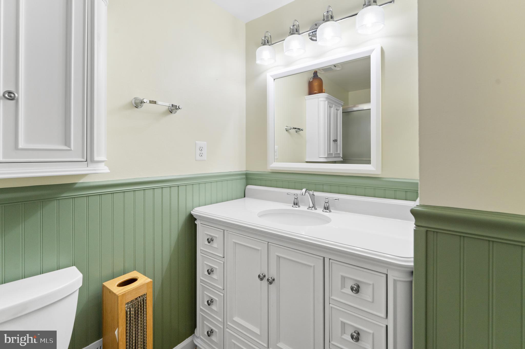 5922 Michael Road Waldorf, MD 20601 - Photo 18 of 43 a bathroom with a sink and a mirror