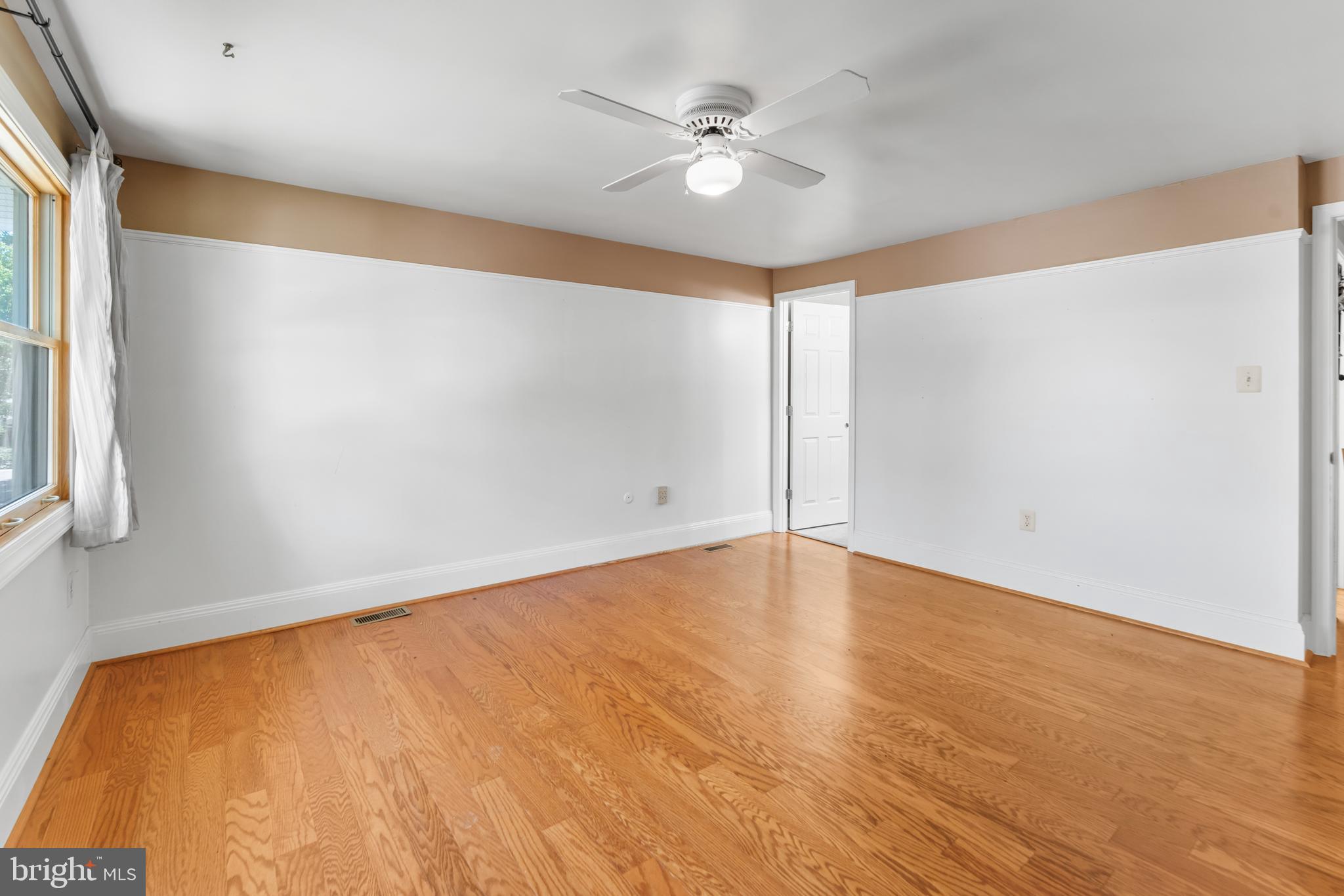 5922 Michael Road Waldorf, MD 20601 - Photo 21 of 43 an empty room with a window and a ceiling fan