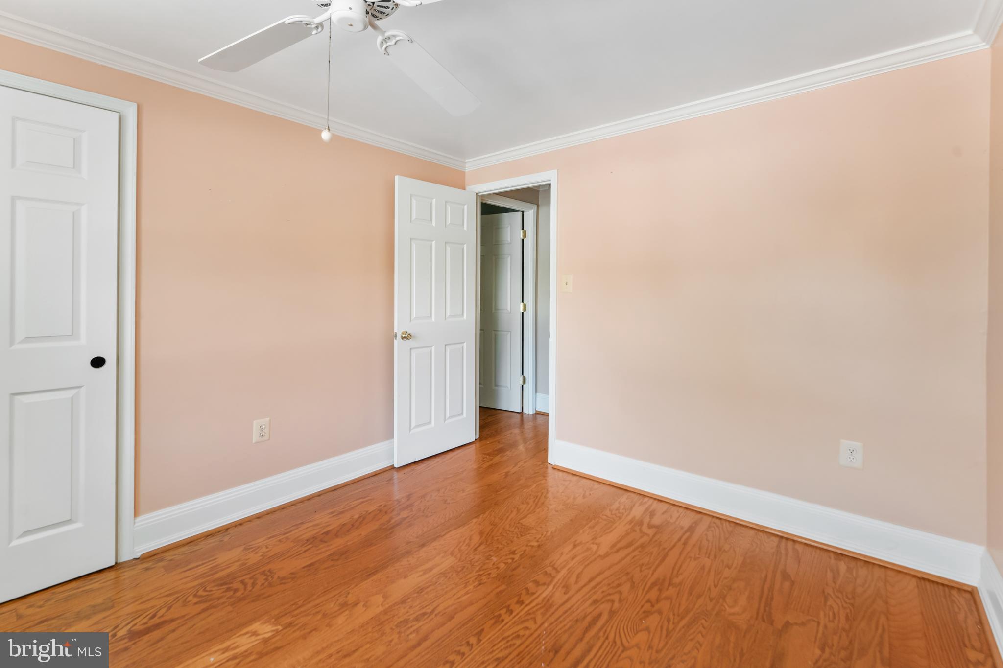 5922 Michael Road Waldorf, MD 20601 - Photo 24 of 43 an empty room with wooden floor and a ceiling fan