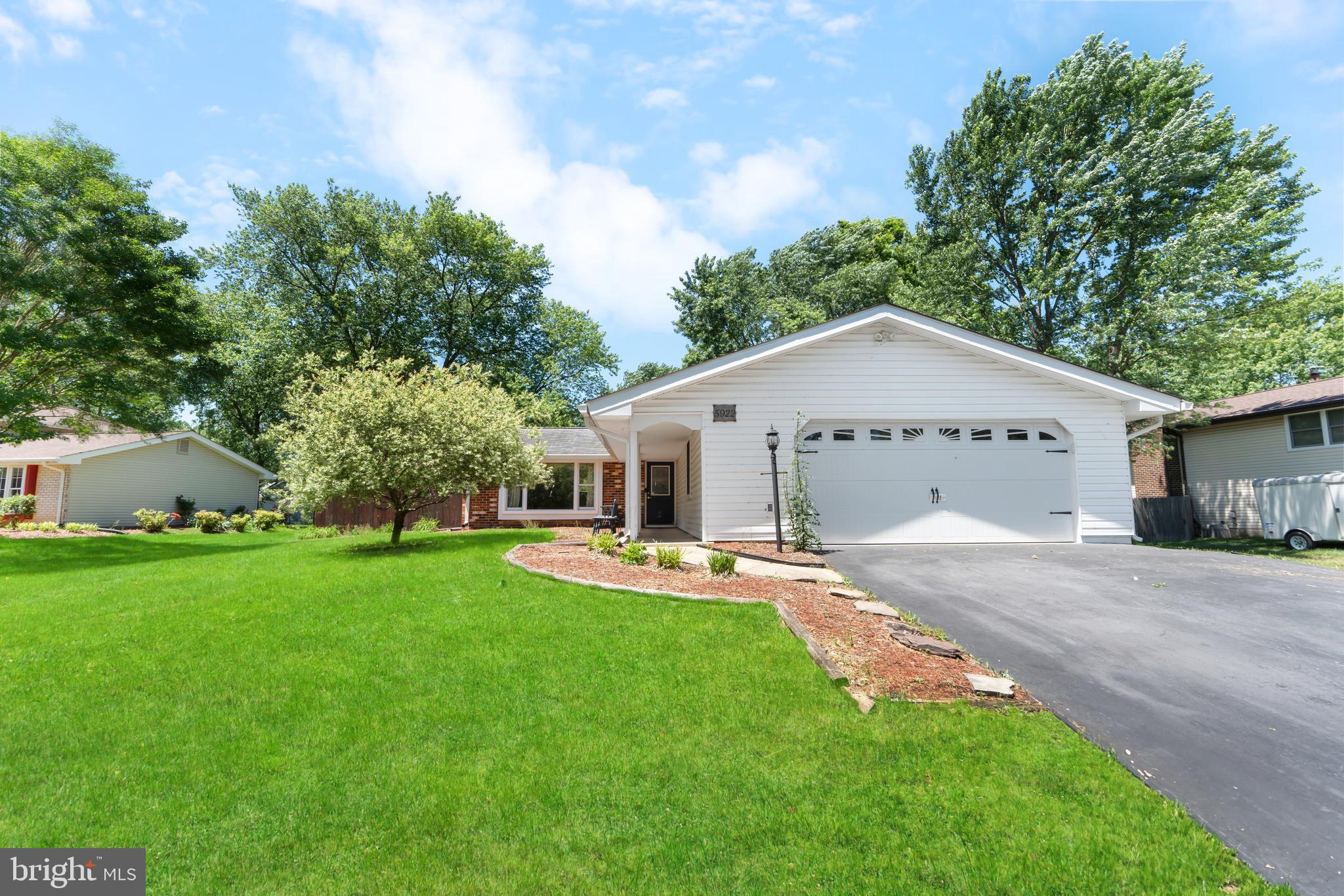 5922 Michael Road Waldorf, MD 20601 - Photo 3 of 43 a view of a backyard with plants and large tree