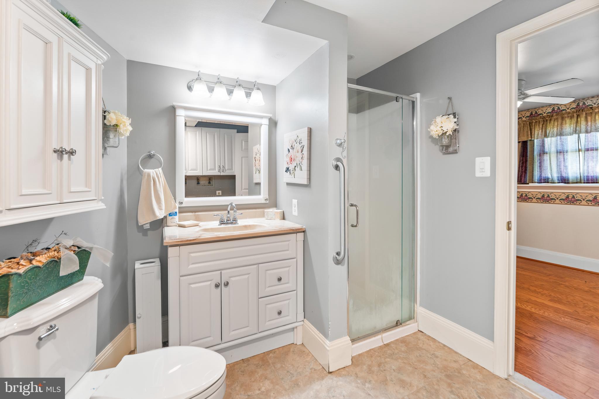 5922 Michael Road Waldorf, MD 20601 - Photo 36 of 43 a bathroom with a sink vanity granite and a mirror