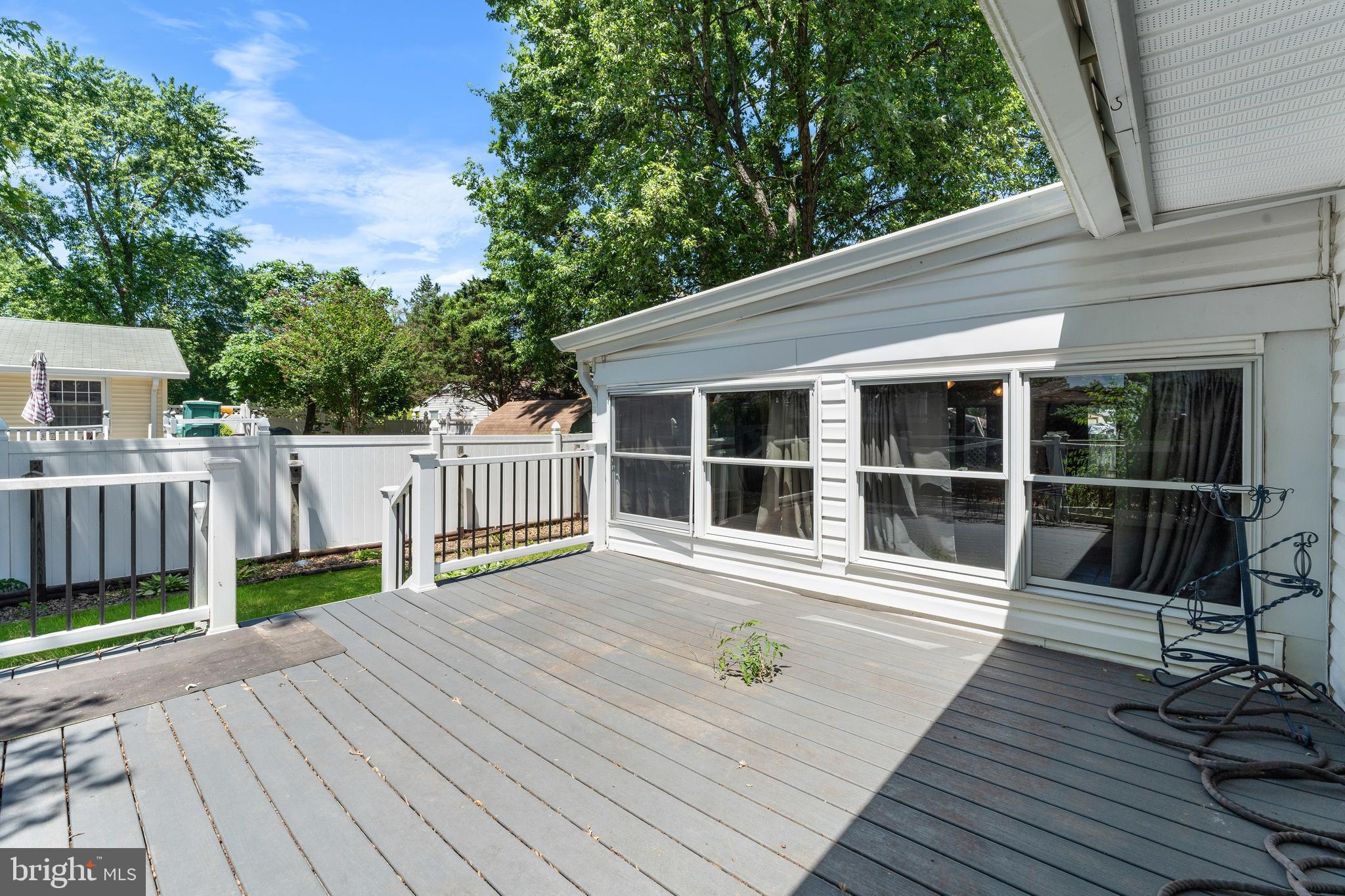 5922 Michael Road Waldorf, MD 20601 - Photo 37 of 43 a view of balcony with wooden floor and fence and a trees