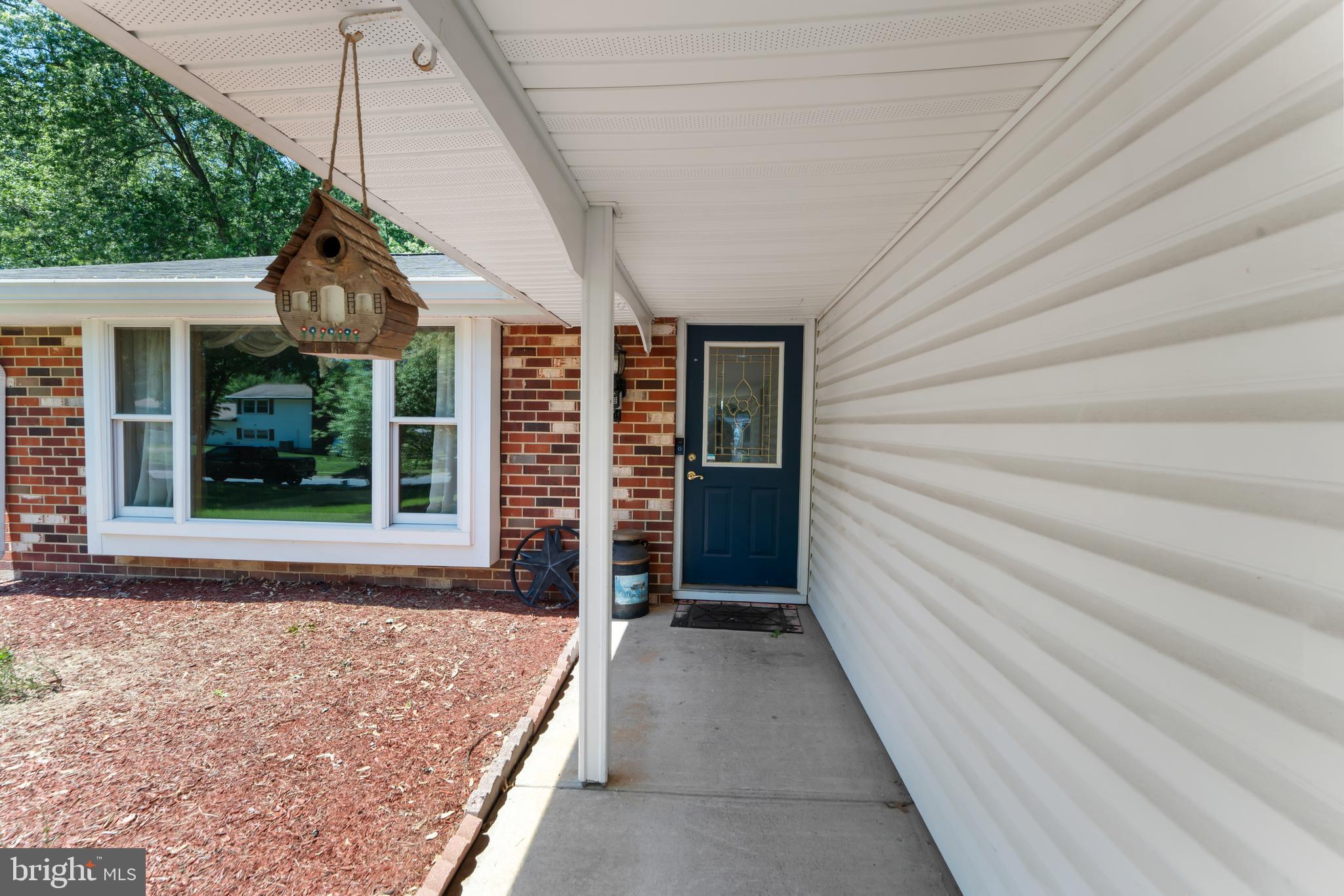 5922 Michael Road Waldorf, MD 20601 - Photo 7 of 43 a front view of a house with a porch