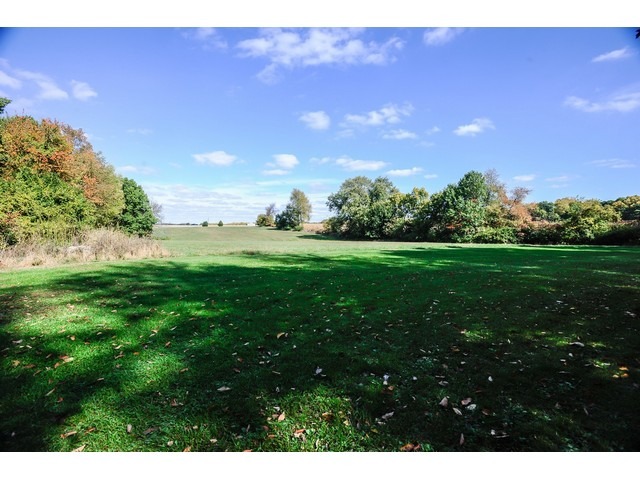 4452 West Edgewood Road Dixon, IL 61021 - Photo 22 of 25 a view of yard with grass and a building