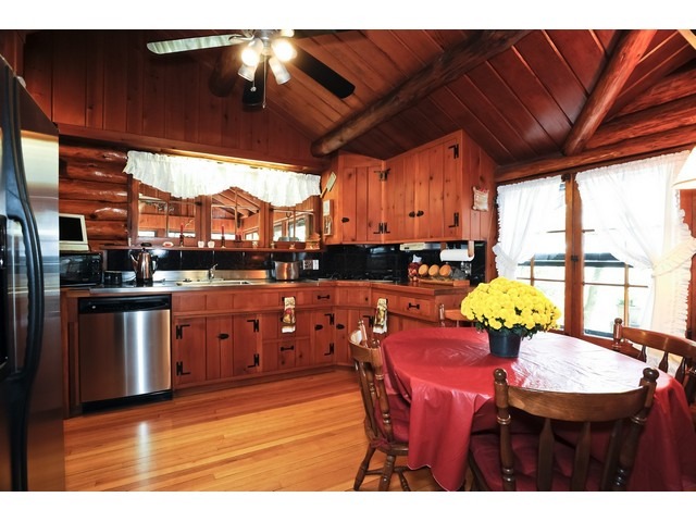 4452 West Edgewood Road Dixon, IL 61021 - Photo 5 of 25 a view of a dining room with furniture and chandelier