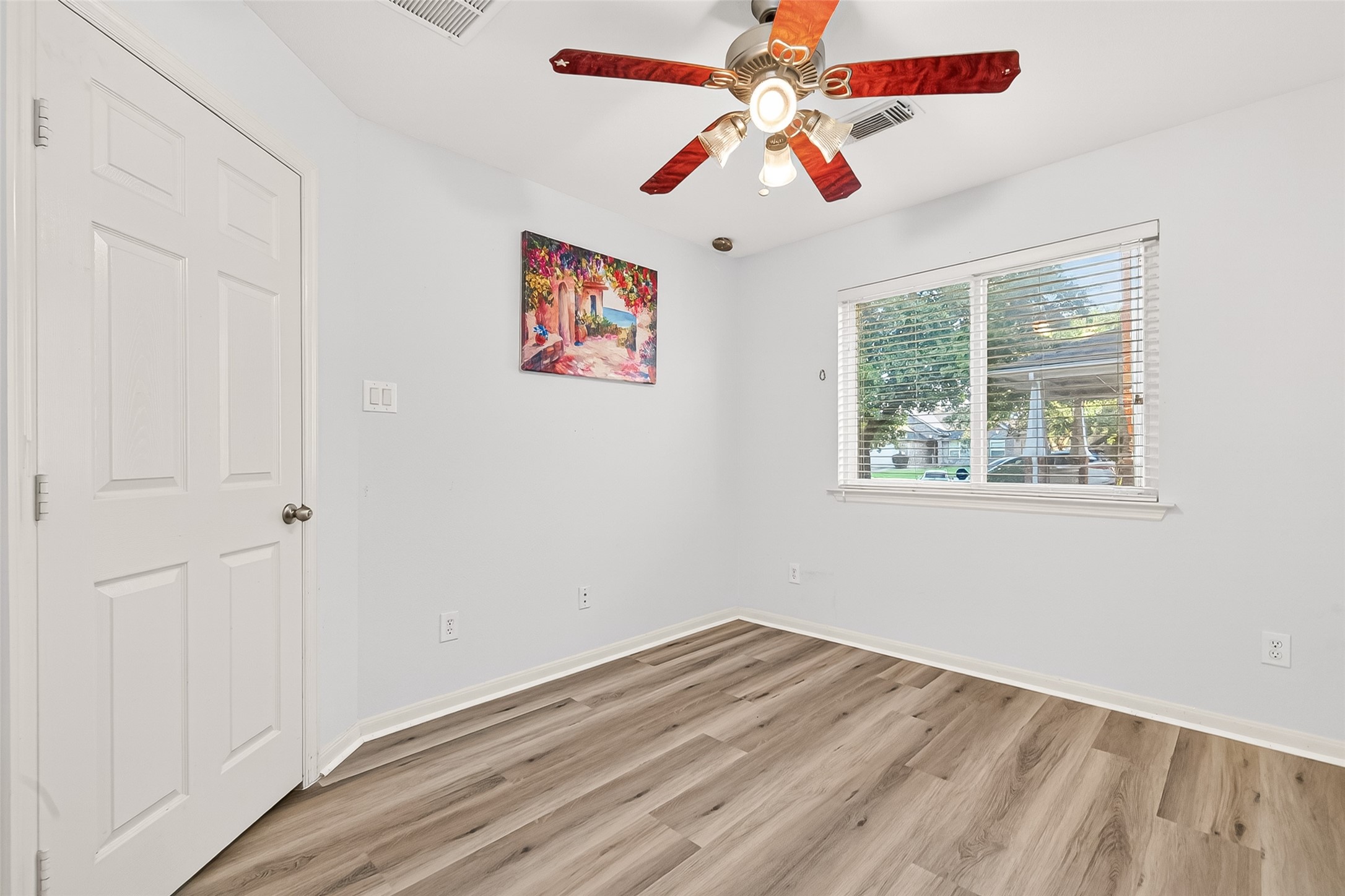 16715 Mackenzie Mesa Drive Spring, TX 77379 - Photo 30 of 50 an empty room with a window and a fan