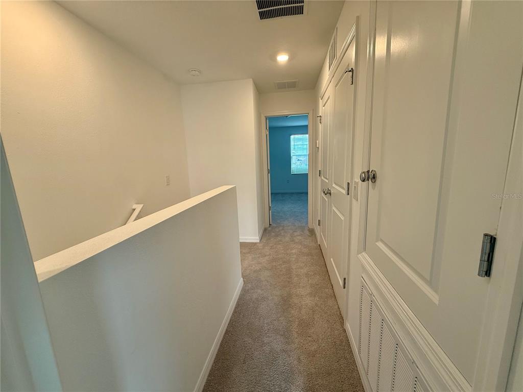 2996 Skyline Loop Kissimmee, FL 34758 - Photo 11 of 26 a view of hallway with stairs