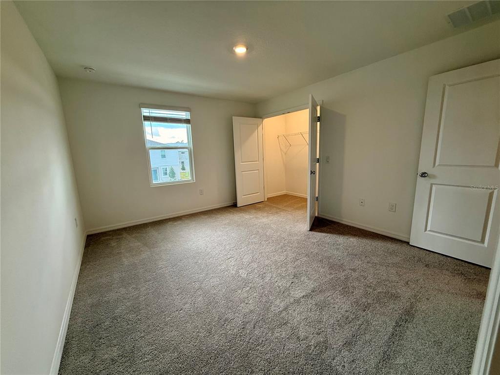 2996 Skyline Loop Kissimmee, FL 34758 - Photo 15 of 26 an empty room with windows