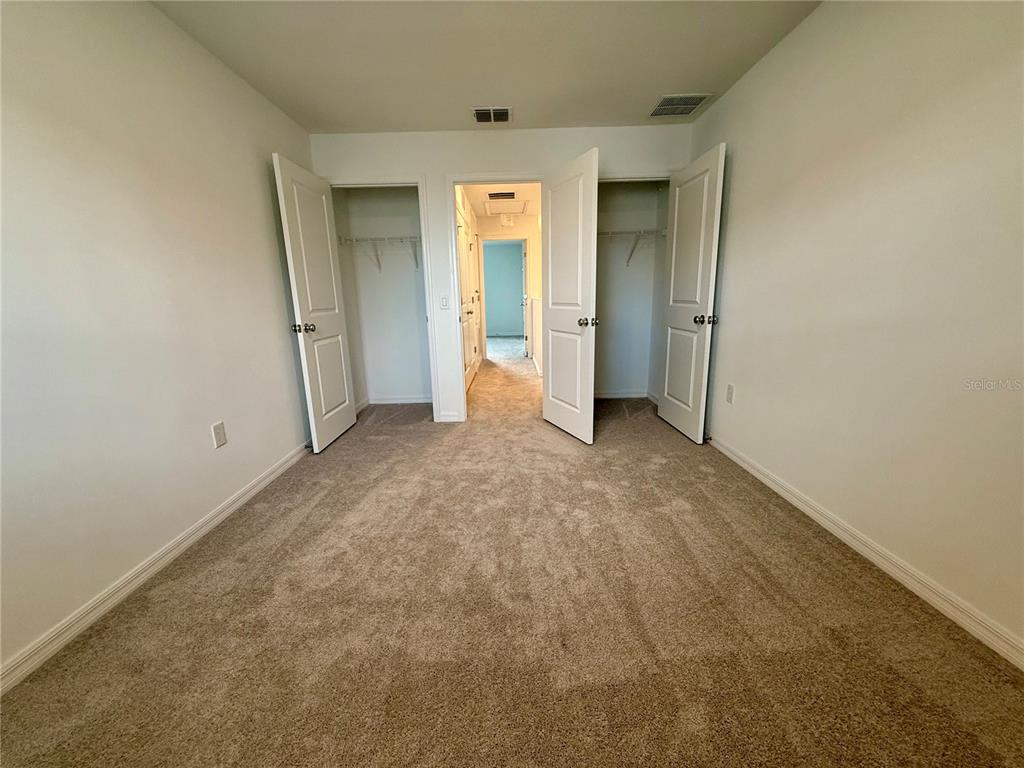 2996 Skyline Loop Kissimmee, FL 34758 - Photo 20 of 26 a view of an empty room with closet and a window
